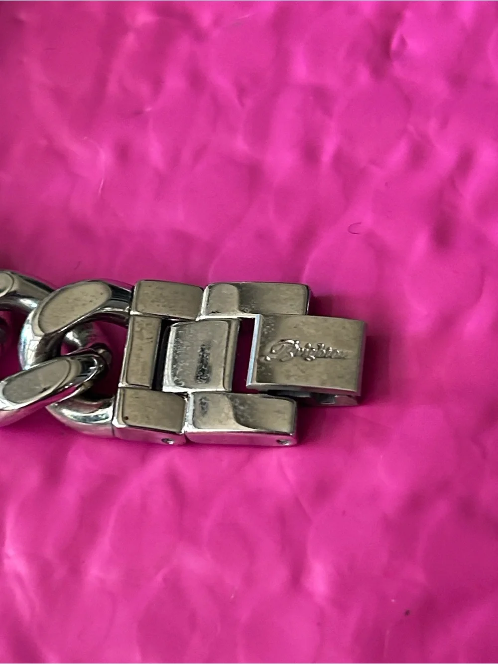 Brighton chain-link watch showcasing the ornate, scrollwork cut-out motif
